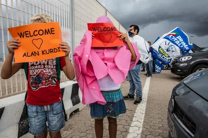 A moment of the arrival of the navy alan kurdi with 125 on board at the port of Olbia, 25 September 2020. ANSA/GIAN MARIO SIAS