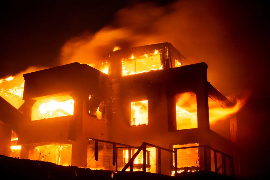 <p>Flames rise from a structure as the Palisades fire burns during a windstorm on the west side of Los Angeles, California, U.S. January 8, 2025. REUTERS/Ringo Chiu</p>\\n